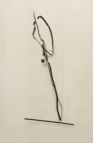 A long piece of wire is hanging on the wall.