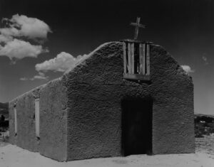A black and white photo of an old church