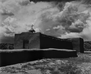 A black and white photo of an old church