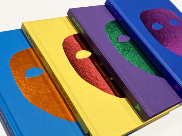 A close up of four notebooks with different colors