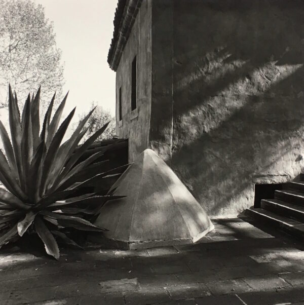 A black and white photo of a building with stairs
