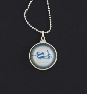 A necklace with a picture of a scooter on it.