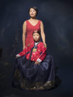 A woman and child in traditional korean dress.