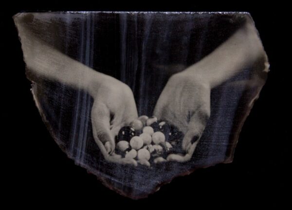 A person holding a bowl of food in their hands.