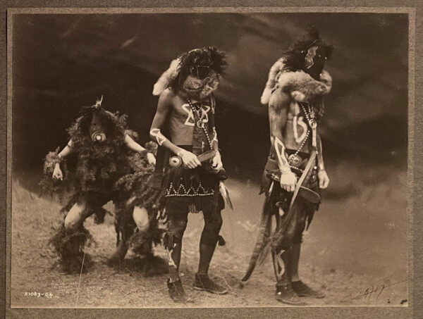 A group of native americans standing next to each other.