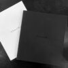 A black and white photo of two books.