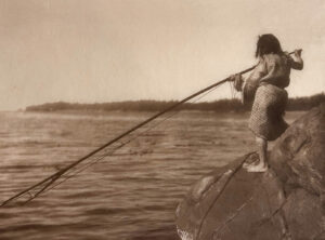 A person on a boat in the water.