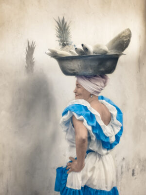 NEVADA WIER. Colombia. Cartagena. Anjelica. Palanquera carrying fruit. 2017