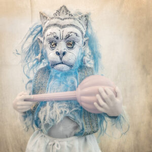 A person in costume holding a spoon