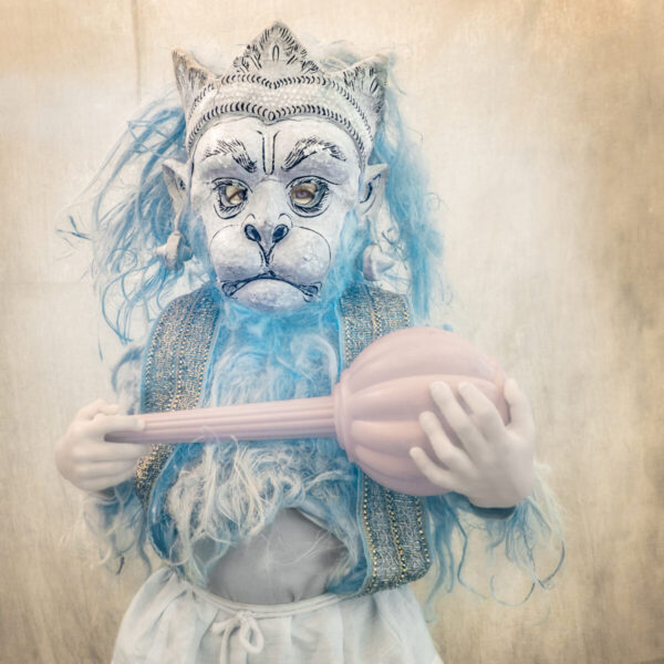A person in costume holding a spoon