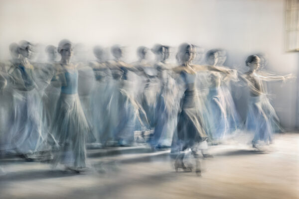 A group of people in blue and white outfits.