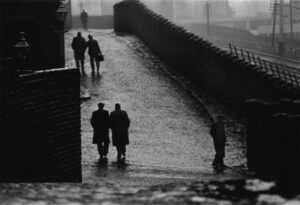 A group of people walking down the street.