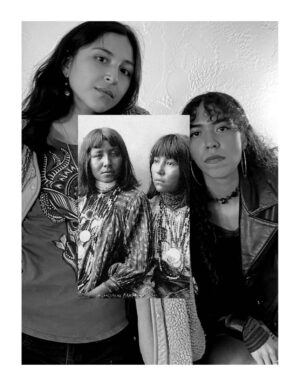 Three women posing for a picture with their photo.
