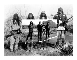 A group of people standing in the grass.