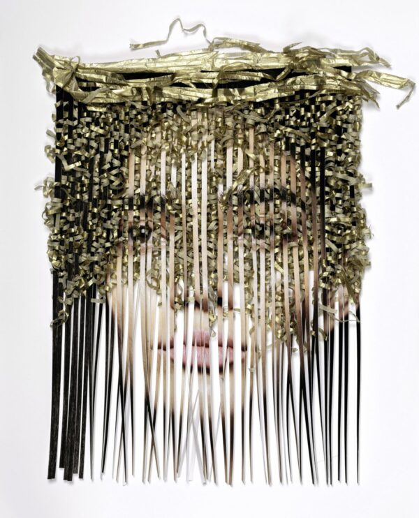 A woman 's face is made up of many strands.