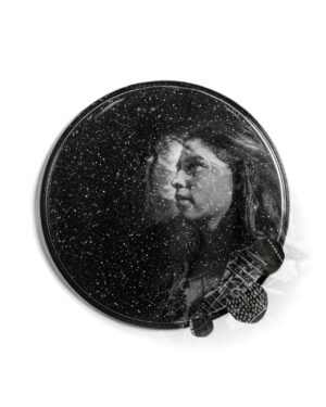 A black and white photo of a woman 's face.