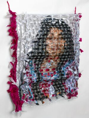 A picture of a woman made out of plastic bags.