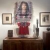 A display of an indian woman and other items.