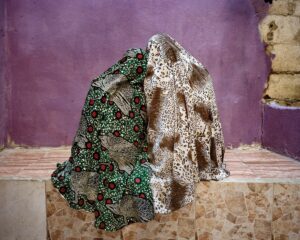 A pair of leopard print and green fabric on display.
