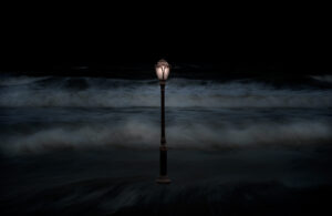 A lamp post with fog in the background