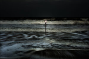 A lamp post in the middle of the ocean
