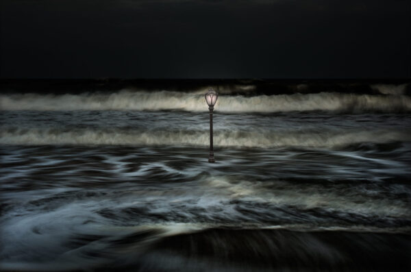 A lamp post in the middle of the ocean