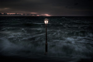 A lamp post in the middle of the ocean