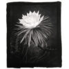 A black and white photo of a flower