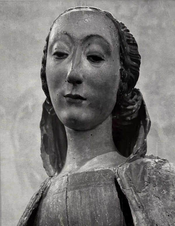 A statue of a woman with long hair.