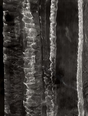 A black and white photo of some ice