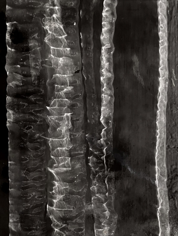 A black and white photo of some ice