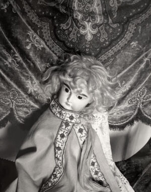 A doll with long hair and a dress