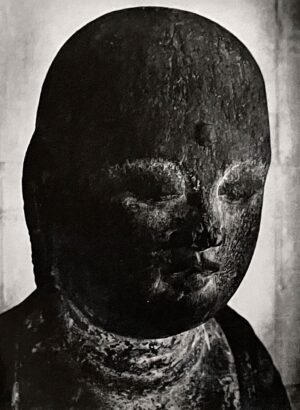 A black and white photo of a statue