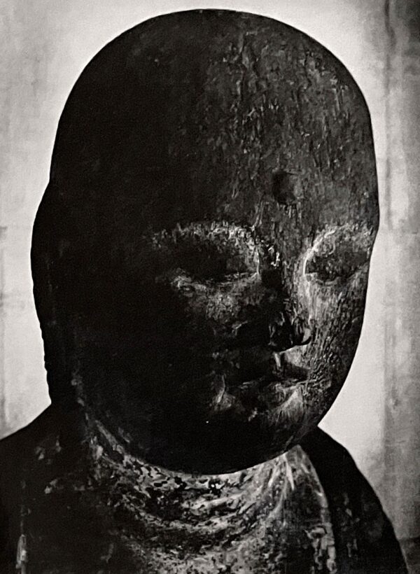 A black and white photo of a statue