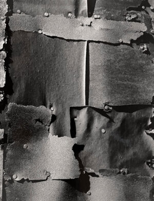 A black and white photo of torn paper.