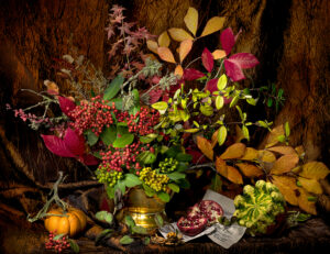 A table with flowers and other plants on it