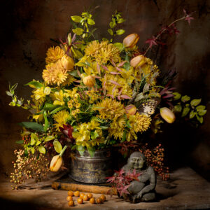 A vase of flowers and some small statues