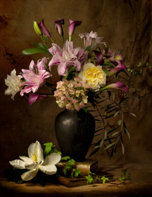 A vase of flowers and a flower on the table.