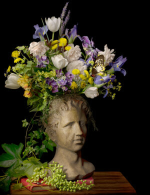 A statue with flowers on top of it