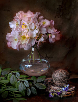 A vase with flowers in it sitting on top of a table.
