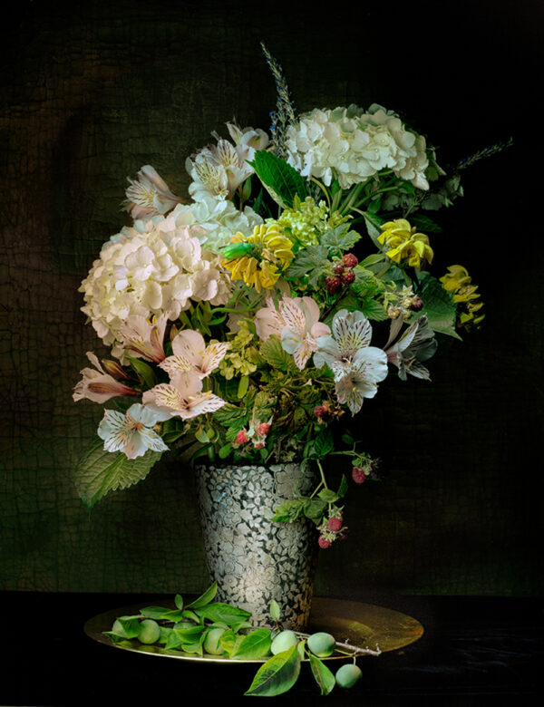 A vase filled with flowers on top of a table.
