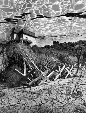 A black and white photo of a fence