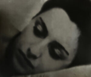 A blurry image of a woman 's face