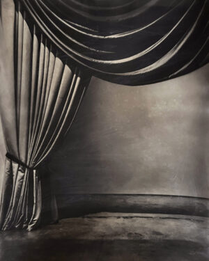 A black and white photo of a curtain.