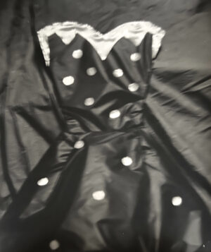 A black dress with white polka dots on it
