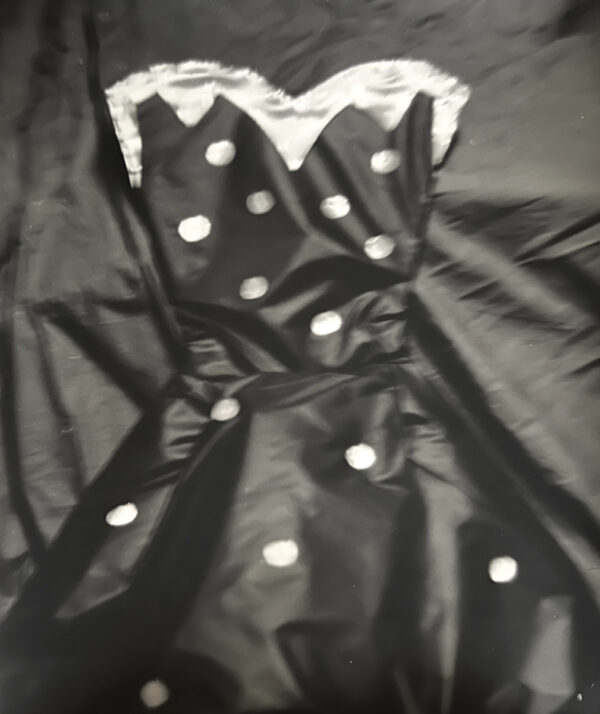A black dress with white polka dots on it