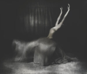 A woman is standing on her back legs