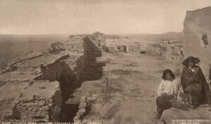 A person standing on top of a cliff.