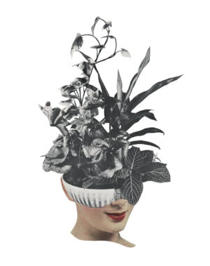 A woman wearing a hat with plants on it.