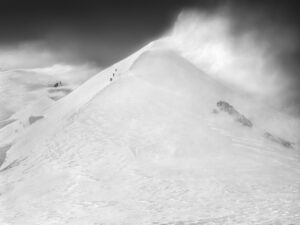 A person skiing down the side of a mountain.